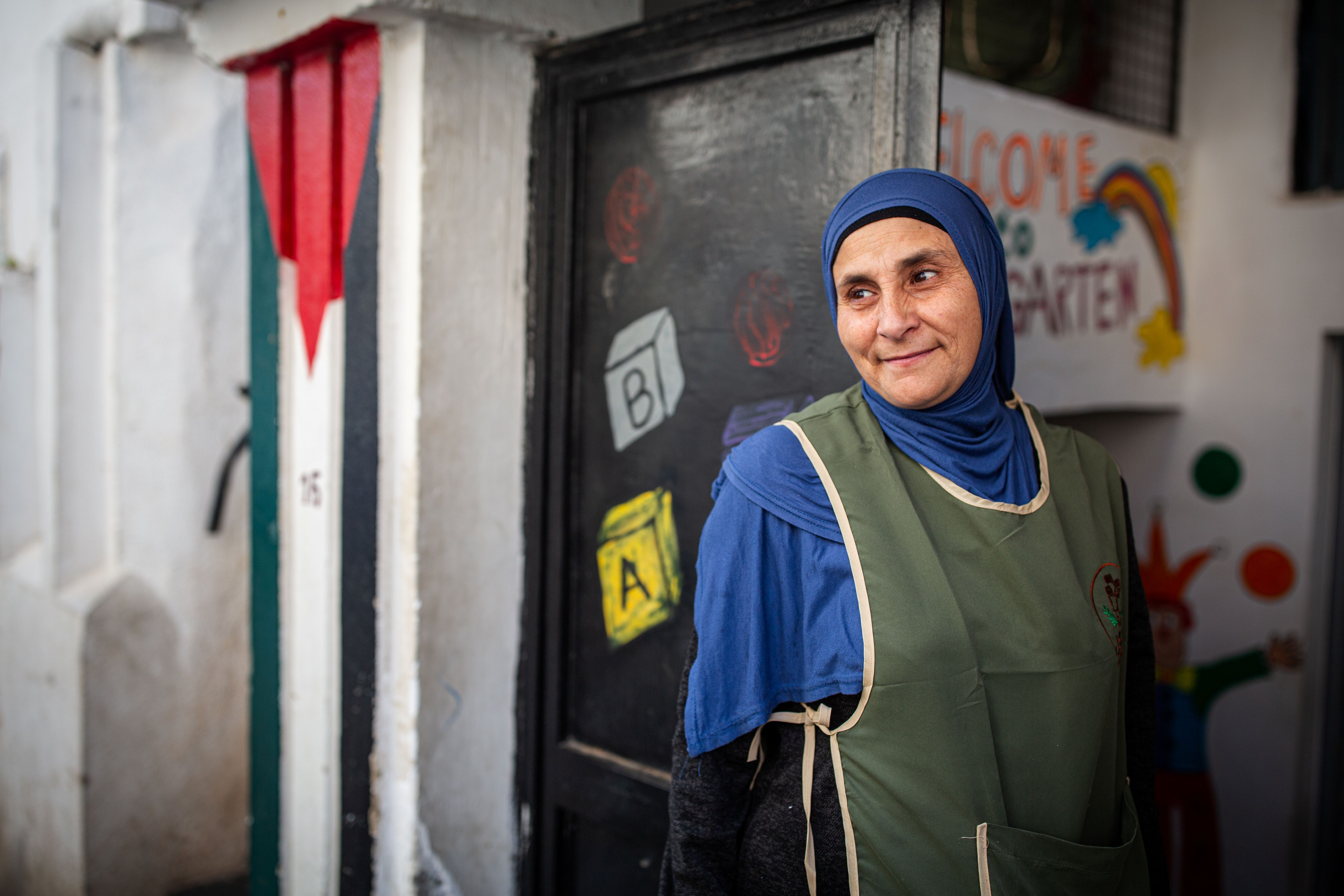 Gaza woman looking over her shoulder to somewhere off camera left